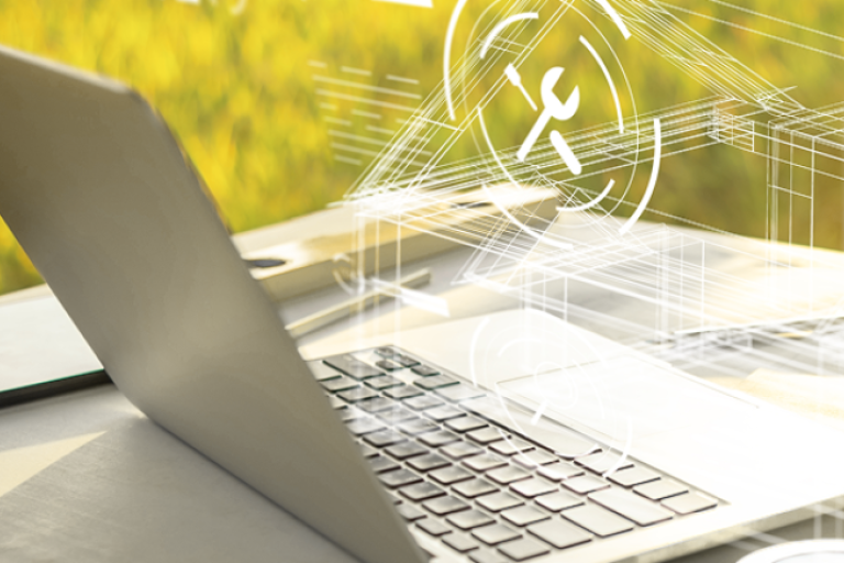 Notebook aberto sobre mesa com fundo verde, exibindo sobreposição de ícones digitais relacionados a ferramentas e tecnologia.